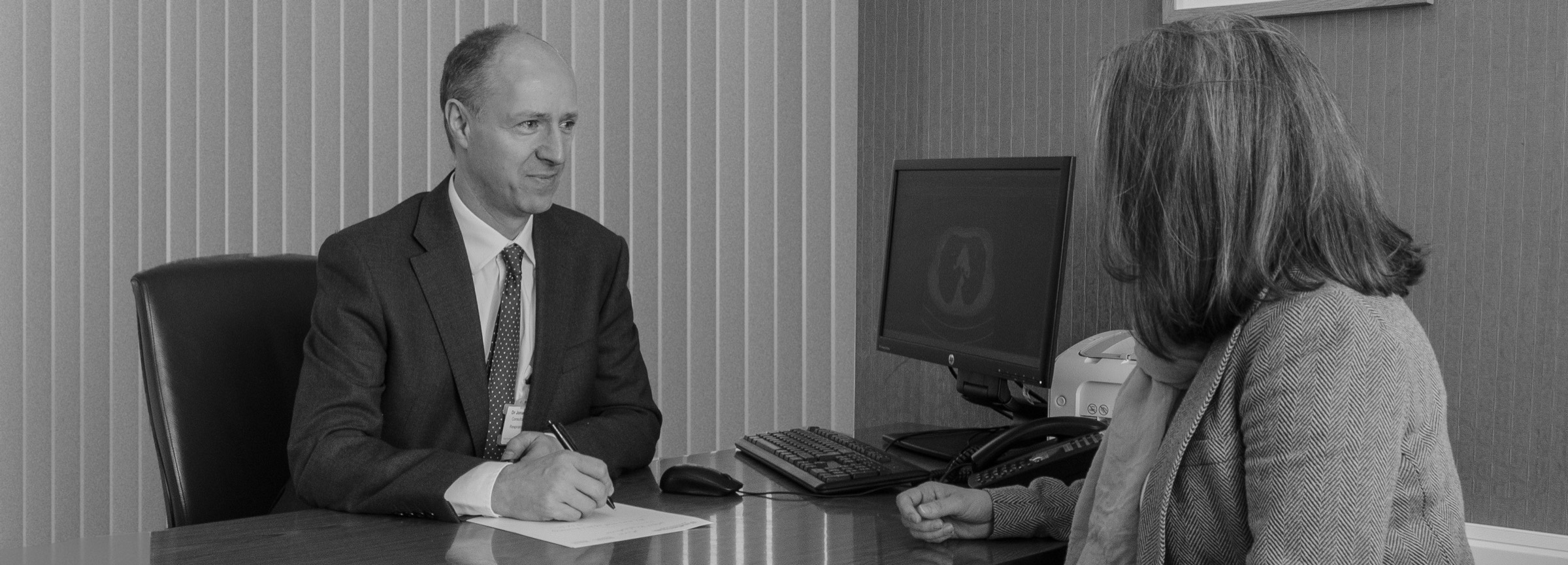 Dr Dakin in consultation with a patient